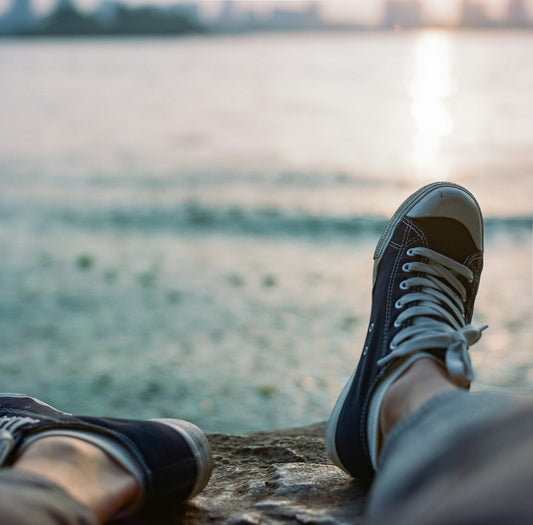 person wearing black and white sneakers