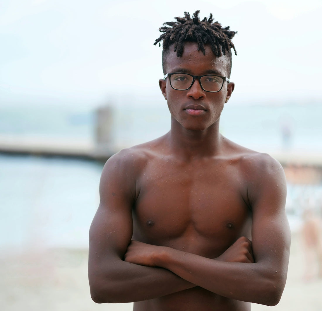 topless man wearing black framed eyeglasses