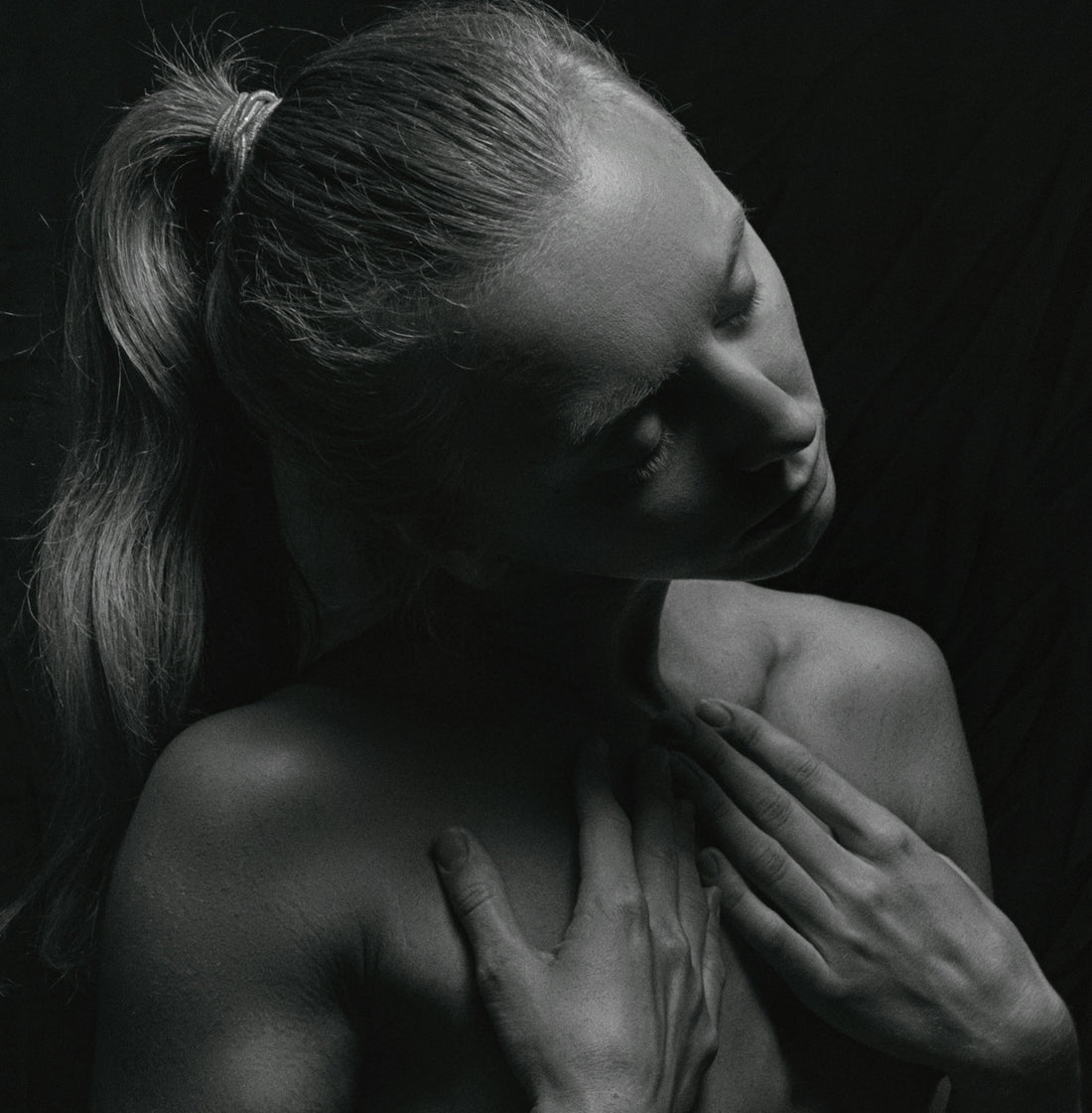 a black and white photo of a naked woman