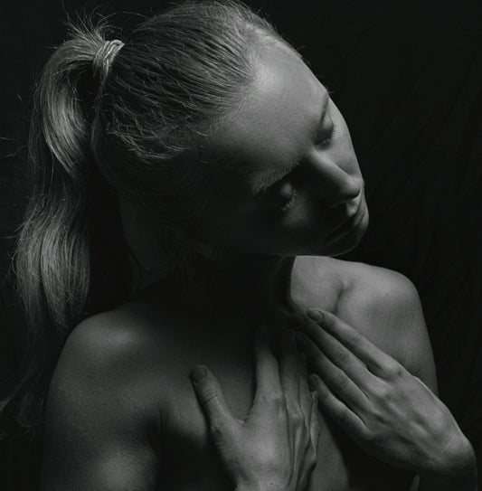 a black and white photo of a naked woman
