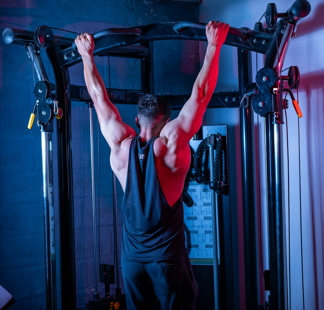 A man doing a pull up on a pull up bar